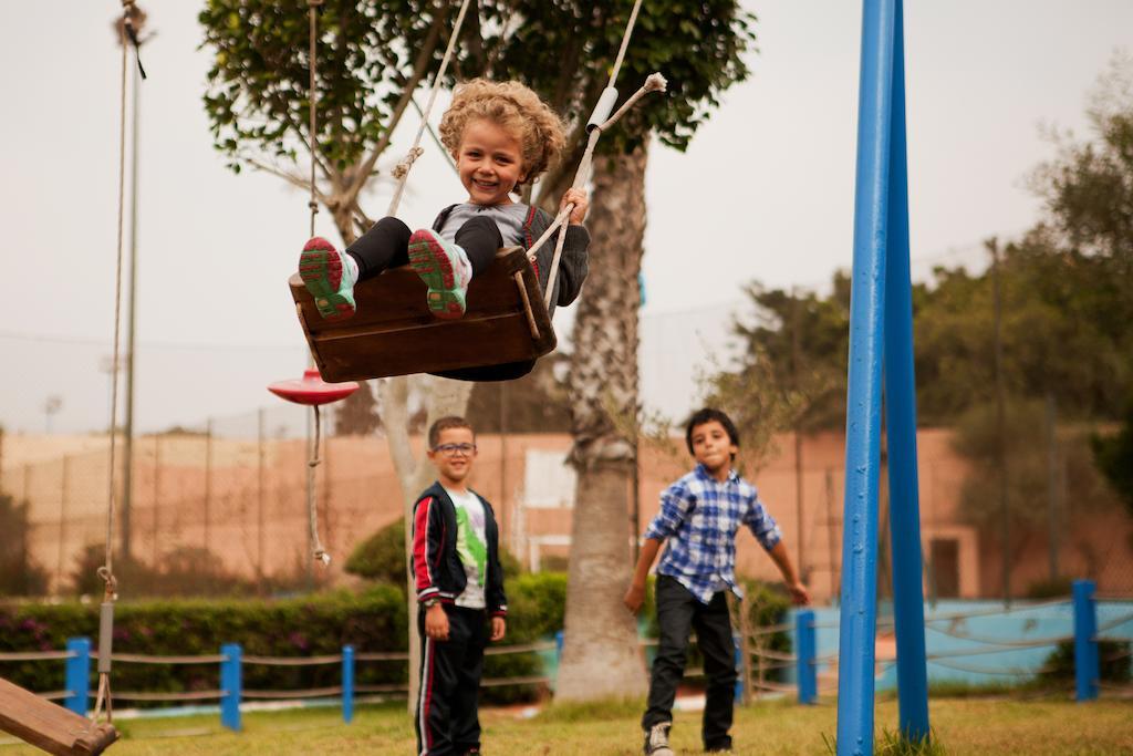 Kenzi Europa Hotel Agadir Exterior foto Children playing on a swing